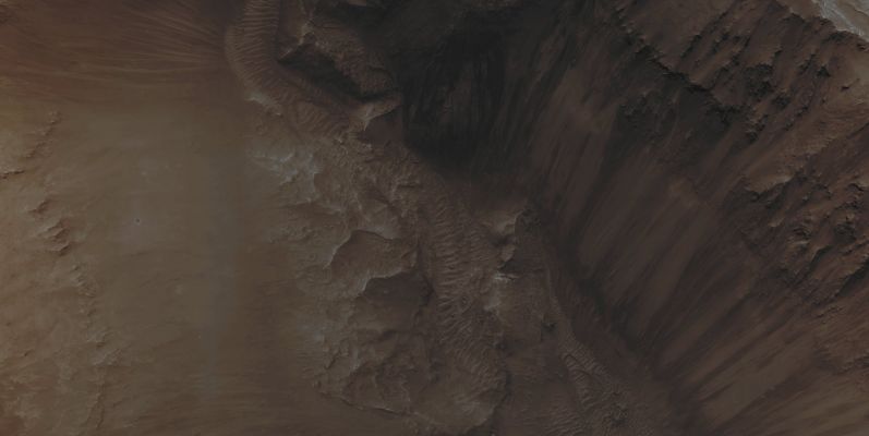 The Wall of Coprates Chasma (Absolute Natural Colors; credits for the additional process. and color: Dr Paolo C. Fienga/Lunar Explorer Italia/Italian Planetary Foundation)
Mars Local Time: 14:08 (Early Afternoon)
Coord. (centered): 15,599° South Lat. and 300,540° East Long.
Spacecraft altitude: 258,8 Km (such as about 161,7 miles) 
Original image scale range: 51,8 cm/pixel (with 2 x 2 binning) so objects ~ 1 mt and 55 cm across are resolved
Map projected scale: 50 cm/pixel
Map projection: EQUIRECTANGULAR
Emission Angle: 6,9° 
Sun - Mars - MRO (or "Phase") Angle: 37,9°
Solar Incidence Angle: 31° (meaning that the Sun is about 59° above the Local Horizon)
Solar Longitude: 320,3° (Northern Winter - Southern Summer)
Credits: NASA/JPL/University of Arizona
Additional process. and coloring: Lunar Explorer Italia/Italian Planetary Foundation
Parole chiave: Mars from orbit - Chasmas - Coprates Chasma