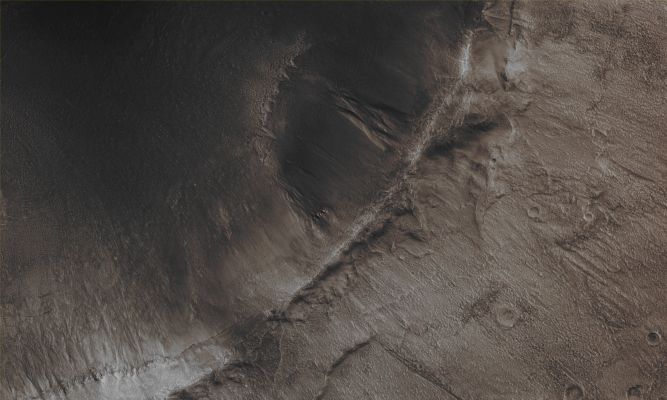 Unnamed Northern Crater with deeply incised Gullies (CTX Frame "B" - Absolute Natural Colors; credits for the additional process. and color.: Dr Paolo C. Fienga - Lunexit Team)
Mars Local Time: 14:08 (early afternoon)
Coord. (centered): 43,5° North Lat. and 319,4° East Long.
Spacecraft altitude: 304,2 Km (such as about 190,1 miles) 
Original image scale range: 30,4 cm/pixel (with 1 x 1 binning) so objects ~ 91 cm across are resolved
Map projected scale: 25 cm/pixel
Map projection: EQUIRECTANGULAR
Emission Angle: 9,2° 
Phase Angle: 47,5°
Solar Incidence Angle: 54° (meaning that the Sun is about 36° above the Local Horizon)
Solar Longitude: 355,5° (Northern Winter)
Credits: NASA/JPL/University of Arizona
Additional process. and coloring: Lunar Explorer Italia
Parole chiave: Mars from orbit - Craters - Unnamed Crater with Gullies