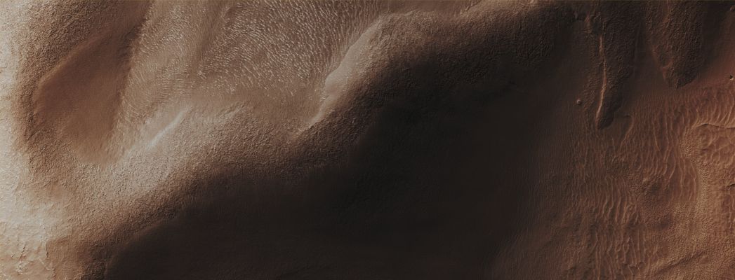 Massif in Reull Vallis (Enhanced Absolute Natural Colors; credits for the additional process. and color.: Dr Paolo C. Fienga - Lunexit Team)
Mars Local Time: 14:23 (Early Afternoon)
Coord. (centered): 43,3° South Lat. and 97,1° East Long.
Spacecraft altitude: 253,6 Km (such as about 158,5 miles) 
Original image scale range: 50,7 cm/pixel (with 2 x 2 binning) so objects ~ 1 mt and 52 cm across are resolved 
Map projected scale: 50 cm/pixel
Map projection: EQUIRECTANGULAR
Emission Angle: 7,4° 
Sun-Mars-Spacecraft (or "Phase") Angle: 59,1°
Solar Incidence Angle: 54° (meaning that the Sun is about 36° above the Local Horizon)
Solar Longitude: 360,0° (Northern Winter)
Credits: NASA/JPL/University of Arizona
Additional process. and coloring: Dr Paolo C. Fienga - Lunar Explorer Italia
Parole chiave: Mars from orbit - Channels - Reull Vallis