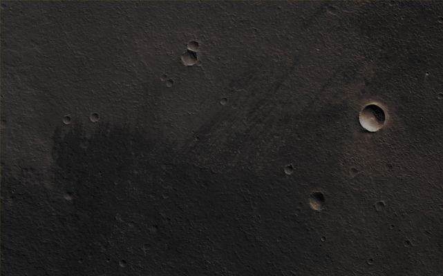 Small Volcano near Western Mareotis Tholus (CTX "B" - Absolute Natural Colors; credits for the additional process. and color.: Dr Paolo C. Fienga - Lunexit Team)
Mars Local Time: 14:09 (Early Afternoon)
Coord. (centered): 36,5° North Lat. and 271,5° East Long.
Spacecraft altitude: 289,6 Km (such as about 181,0 miles) 
Original image scale range: 29,0 cm/pixel (with 1 x 1 binning) so objects ~ 87 cm across are resolved 
Map projected scale: 25 cm/pixel
Map projection: EQUIRECTANGULAR
Emission Angle: 0,8° 
Sun-Mars-Spacecraft (or "Phase") Angle: 46,3°
Solar Incidence Angle: 47° (meaning that the Sun is about 43° above the Local Horizon)
Solar Longitude: 1,8° (Northern Spring)
Credits: NASA/JPL/University of Arizona
Additional process. and coloring: Dr Paolo C. Fienga - Lunar Explorer Italia
Parole chiave: Mars from orbit - Volcanoes - Unnamed Small Volcano