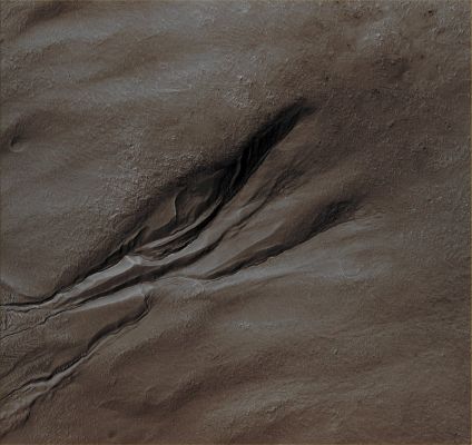 Gullies on Massif (Enhanced Absolute Natural Colors; credits for the additional process. and color.: Dr Paolo C. Fienga - Lunexit Team) 
Mars Local Time: 14:31 (Early Afternoon)
Coord. (centered): 39,6° South Lat. and 310,7° East Long.
Spacecraft altitude: 252,2 Km (such as about 157,6 miles) 
Original image scale range: 25,2 cm/pixel (with 1 x 1 binning) so objects ~ 76 cm across are resolved 
Map projected scale: 25 cm/pixel
Map projection: EQUIRECTANGULAR
Emission Angle: 3,9° 
Sun-Mars-Spacecraft (or "Phase") Angle: 52,7°
Solar Incidence Angle: 55° (meaning that the Sun is about 35° above the Local Horizon)
Solar Longitude: 7,3° (Northern Spring)
Credits: NASA/JPL/University of Arizona
Additional process. and coloring: Drr Gianluigi Barca and Paolo C. Fienga - Lunar Explorer Italia
Parole chiave: Mars from orbit - Gullies - N/W of Argyre Planitia