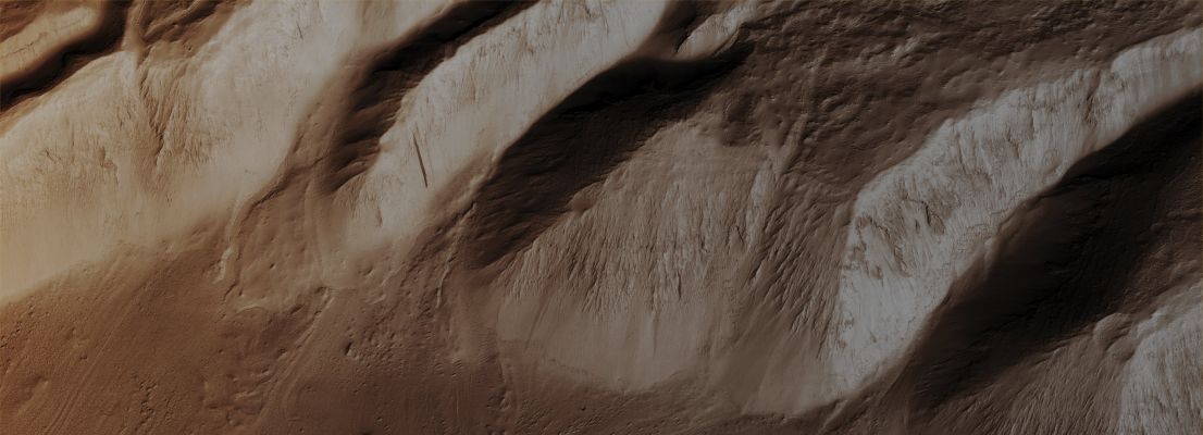 Valley Termini on Western Hecates Tholus (CTX "A" - Enhanced Natural Colors; credits for the additional process. and color.: Dr Paolo C. Fienga - Lunexit Team)
Mars Local Time: 14:21 (Early Afternoon)
Coord. (centered): 32,4° North Lat. and 149,1° East Long.
Spacecraft altitude: 302,8 Km (such as about 189,3 miles) 
Original image scale range: 60,6 cm/pixel (with 2 x 2 binning) so objects ~ 1 mt and 82 cm across are resolved 
Map projected scale: 50 cm/pixel
Map projection: EQUIRECTANGULAR
Emission Angle: 16,8° 
Sun-Mars-Spacecraft (or "Phase") Angle: 30,0°
Solar Incidence Angle: 44° (meaning that the Sun is about 46° above the Local Horizon)
Solar Longitude: 8,5° (Northern Spring)
Credits: NASA/JPL/University of Arizona
Additional process. and coloring: Dr Paolo C. Fienga - Lunar Explorer Italia
Parole chiave: Mars from orbit - Volcanoes - Hecates Tholus