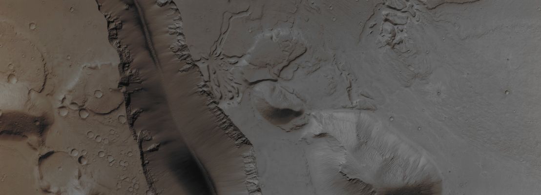 Unusually-looking Landforms near Grota Valles (Absolute Natural Colors; credits for the additional process. and color.: Dr Paolo C. Fienga - Lunexit Team)
The Landforms visible in this observation are quite diverse, with a segment of the Cerberus Fossae (such as a deep Trough extending East-West) and Surrounding Terrain that has been eroded by some Fluid, either Water (actually Mud) or Lava. There are also many Boulders in places, either on steep Slopes or excavated by Impact Craters. The high Hills are Islands of older Terrain surrounded by younger Lavas.

Mars Local Time: 15:08 (Early Afternoon)
Coord. (centered): 15,724° North Lat. and 162,022° East Long.
Spacecraft altitude: 281,3 Km (such as about 175,8 miles) 
Original image scale range: 28,1 cm/pixel (with 1 x 1 binning) so objects ~ 84 cm across are resolved
Map projected scale: 25 cm/pixel
Map projection: EQUIRECTANGULAR
Emission Angle: 4,7° 
Sun - Mars - MRO (or "Phase") Angle: 40,5°
Solar Incidence Angle: 45° (meaning that the Sun is about 45° above the Local Horizon)
Solar Longitude: 81,7° (Northern Spring - Southern Autumn)
Credits: NASA/JPL/University of Arizona
Additional process. and coloring: Lunar Explorer Italia
Parole chiave: Mars from orbit - Channels - Proximities of Grota Valles