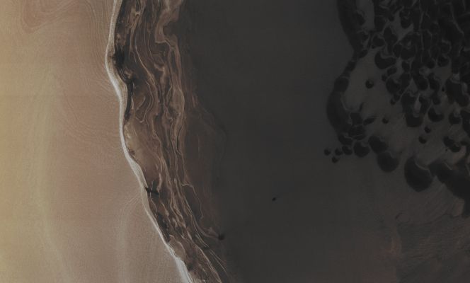 Features of the North Polar Regions (Absolute Natural Colors; credits for the additional process. and color.: Dr Paolo C. Fienga/Lunexit Team)
There is an Ice-Sheet at the North Pole of Mars that is a few miles thick at its center. At some places (like in this image) it ends in steep Cliffs that can be about 800 meters (2600 feet) high. 
The Slopes of these Cliffs are almost vertical, which causes "Slab-like Blocks" of Ice to periodically (and, actually, quite often) break off and crash down onto the Surrounding Plains. 
A dense Network of Cracks covers these Icy Cliff faces, thus making it easier for these Blocks to break free. New piles of Debris (located at the base of many of these Cliffs) have appeared in successive HiRISE images, and so the MRO Team shall regularly monitor sites like this in order to check for new Blocks that might have fallen. Understanding how these Cliffs are formed can help Scientists to better understand the "Climatic Record" which are stored in the Ice-Sheet itself.

Mars Local Time: 13:44 (Early Afternoon)
Coord. (centered): 83,618° North Lat. and 119,827° East Long.
Spacecraft altitude: 320,5 Km (such as about 200,3 miles) 
Original image scale range: 32,1 cm/pixel (with 1 x 1 binning) so objects ~ 96 cm across are resolved
Map projected scale: 25 cm/pixel
Map projection: POLAR STEREOGRAPHIC
Emission Angle: 0,1° 
Sun - Mars - MRO (or "Phase") Angle: 62,8°
Solar Incidence Angle: 63° (meaning that the Sun is about 27° above the Local Horizon)
Solar Longitude: 120,0° (Northern Summer - Southern Winter)
Credits: NASA/JPL/University of Arizona
Additional process. and coloring: Lunar Explorer Italia
Parole chiave: Mars from orbit - North Polar Regions - Scarp