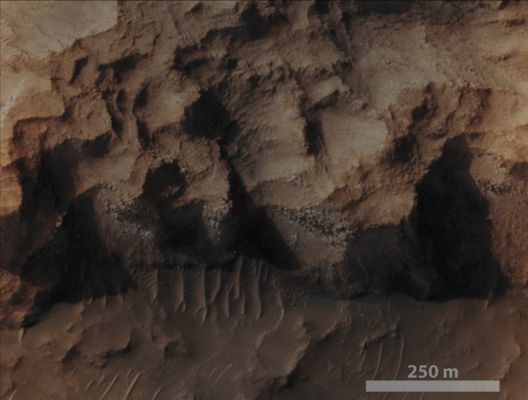 Water-Ice in a Chlorite-bearing Escarpment in North/Western Hellas Planitia (EDM - Absolute Natural Colors; credits for the additional process. and color.: Dr Paolo C. Fienga/Lunar Explorer Italia/Italian Planetary Foundation)
A South-facing Escarpment located in the North/Western part of the Martian Region known as Hellas Planitia (a target that was chosen for the research of Phyllosilicates) showed us the presence, inside the Rocks (---> mostly in their horizontal cracks) forming it, of a pale bluish Material, barely visible in this Absolute Natural Color image. The CRISM Spectra of such Material showed that it consists of a combination of Chlorite and Water Ice. This image was captured by the NASA - Mars Reconnaissance Orbiter during the Southern Martian Winter, such as in the time period when the Southern Hemisphere's South-facing Escarpments (just like this one) of the Red Planet retain Water Ice Deposits that formed during that dark, long and extremely cold Season.

Mars Local Time: 15:36 (Middle Afternoon)
Coord. (centered): 26,501° South Lat. and 55,094° East Long.
Spacecraft altitude: 268,2 Km (such as about 166,552 miles) 
Original image scale range: 26,8 cm/pixel (with 1 x 1 binning) so objects ~ 80 cm across are resolved
Map projected scale: 25 cm/pixel
Map projection: EQUIRECTANGULAR
Emission Angle: 18,0° 
Phase Angle: 56,7°
Solar Incidence Angle: 69° (meaning that the Sun was about 21° above the Local Horizon at the time the picture was taken)
Solar Longitude: 131,4° (Northern Summer - Southern Winter)
Credits: NASA/JPL/University of Arizona
Additional process. and coloring: Lunar Explorer Italia

This picture (which is a NASA - Original Mars Reconnaissance Orbiter NON-Map Projected false color EDM frame identified by the serial n. ESP_027758_1530-1) has been additionally processed, magnified to aid the visibility of the details, contrast enhanced and then re-colorized in Absolute Natural Colors (such as the colors that a human eye would actually perceive if someone were onboard the NASA - Mars Reconnaissance Orbiter and then looked down, towards the Surface of Mars), by using an original technique created - and, in time, dramatically improved - by the Lunar Explorer Italia Team.
Parole chiave: Mars from orbit - Escarment - Hellas Planitia