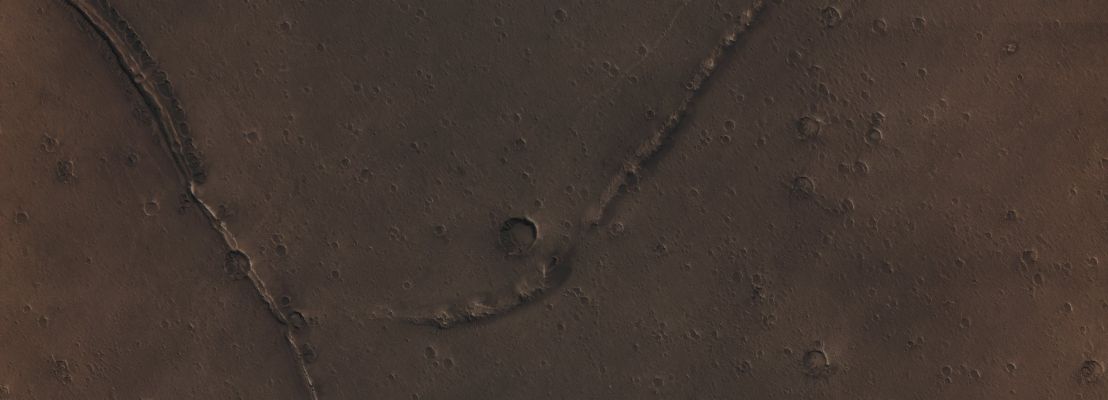 Unusually-looking Surface Feature (CTX Frame - Absolute Natural Colors; credits for the additional process. and color.: Dr Paolo C. Fienga/Lunar Explorer Italia/Italian Planetary Foundation)
This image, taken by the NASA - Mars Reconnaissance Orbiter on March 28, 2013, shows us a number of shallow and Irregular Pit-like Features with Raised Rims, all concentrated along Ridges and other Topographic Features (---> Surface Reliefs). How did these unusually-looking Surface Features form? One idea is that they could be the final and visible result of the Sublimation of shallow lenses of nearly pure Ice but, even assuming that this theory is correct, why do the Pits have Raised Rims? So far, nobody was good enough to answer to that question.
If we keep reasoning about the possible nature of these Surface Features, we also have to say that they cannot - reasonably - be just shallow Impact Craters, because such an alignment seems extremely unlikely (and the irregular margins of the alleged "Impact Craters" would be even harder to explain); furthermore, these Landforms cannot even be Wind-blown Deposits of Material because, all the way next to them, can be seen very many Boulders which are way too big (and therefore too heavy!) to be moved simply by the Wind. 
As you can see, there are younger Wind-blown Drifts on top of the Pits and, for the time being, we have not found a clear (---> substantiated) connection between these Landforms and some possible Volcanic Phenomenon. However, a few Planetary Scientists speculated that there might have been ancient Oceans over this Region, but could this possibility, even if it is correct, somehow be good to satisfactorily explain these Features? The answer is no. Last, but not least, what we see in this frame could also be the result of an ancient Glaciation where, perhaps, powerful Winds deposited Ice-rich Debris next to Topographic Obstacles. 
Future (and closer) images of this Region may provide us with more clues but, for now, this Landforms are still a mystery. Just one of the many, of course...

Mars Local Time: 14:20 (Early Afternoon)
Coord. (centered): 30,959° North Lat. and 339,402° East Long.
Spacecraft altitude: 293,8 Km (such as about 182,449 miles) 
Original image scale range: 58,8 cm/pixel (with 2 x 2 binning) so objects ~ 1 mt and 76 cm across are resolved
Map projected scale: 50 cm/pixel
Map projection: EQUIRECTANGULAR
Emission Angle: 2,6° 
Phase Angle: 62,5°
Solar Incidence Angle: 64° (meaning that the Sun was about 26° above the Local Horizon at the time the picture was taken)
Solar Longitude: 290,8° (Northern Winter - Southern Summer)
Credits: NASA/JPL/University of Arizona
Additional process. and coloring: Lunar Explorer Italia

This picture (which is a NASA - Original Mars Reconnaissance Orbiter NON-Map Projected EDM b/w frame identified by the serial n. ESP_031268_2115-1) has been additionally processed and then colorized in Absolute Natural Colors (such as the colors that a human eye would actually perceive if someone were onboard the NASA - Mars Reconnaissance Orbiter and then looked down, towards the Surface of Mars), by using an original technique created - and, in time, dramatically improved - by the Lunar Explorer Italia Team.
Parole chiave: Mars from orbit - Southern Regions - Unusually-looking Surface Feature