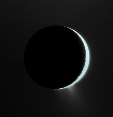 The "Fountains" of Enceladus (again)
Caption NASA:"With Enceladus nearly in front of the Sun from Cassini's viewpoint, its icy jets become clearly visible against the background. 
The view here is roughly perpendicular to the direction of the linear "tiger stripe" fractures, or sulci, from which the jets emanate. The jets here provide the extra glow at the bottom of the moon. The general brightness of the sky around the moon is the diffuse glow of Saturn's E-Ring, which is an end product of the jets' material being spread into a "torus", or doughnut shape, around Saturn. 
North on Enceladus is up and rotated 20° to the left. 

The image was taken in visible light with the Cassini spacecraft narrow-angle camera on Sept. 30, 2007. The view was obtained at a distance of approx. 187.000 Km (such as about 116,000 miles) from Enceladus and at a Sun-Enceladus-spacecraft, or phase, angle of 157°. 
Image scale is about 1 Km (apprx. 0,6 mile) per pixel".
Parole chiave: Saturn's Moons - Enceladus