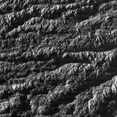 The Enceladus' "Tiger Stripes"
Caption NASA:"This Cassini image was the first and highest resolution 'skeet shoot' narrow-angle image captured during the Oct. 31, 2008, flyby of Saturn's moon Enceladus. 

The image was taken with the Cassini Spacecraft narrow-angle camera on Oct. 31, 2008, at a distance of approximately 1691 Km (about 1056 miles) from Enceladus and at a Sun-Enceladus-Spacecraft, or Phase, Angle of 78°. 
Image scale is roghly 9 meters (29 feet) per pixel.
Parole chiave: Saturn's Moon - Enceladus