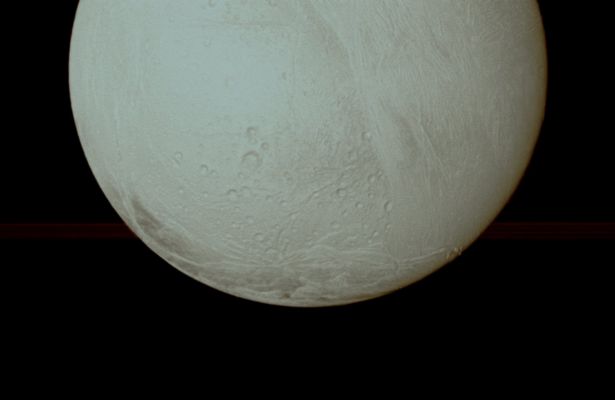 A "Pearl of Ice", in the Night of Saturn (possible Natural Colors; credits: Dr Paolo C. Fienga - Lunexit Team)
Caption NASA:"The Cassini Spacecraft looks toward the South Pole of Enceladus, with a glimpse of Saturns Rings in the distance, during the Spacecraft's close Fly-By of Nov. 2, 2009. 
(see PIA08386 to learn more about the active South Pole of Enceladus) 
This view looks toward the anti-Saturn side of Enceladus. The Rings have been brightened relative to Enceladus to increase visibility. 

The image was taken in Visible Light with the Cassini Spacecraft wide-angle camera on Nov. 2, 2009. The view was acquired at a distance of approx. 10.400 Km (aout 6500 miles) from Enceladus and at a Sun-Enceladus-Spacecraft, or Phase, Angle of 6°. 
Image scale is roughly 630 meters (2100 feet) per pixel".
Parole chiave: Saturn's Moon - Enceladus