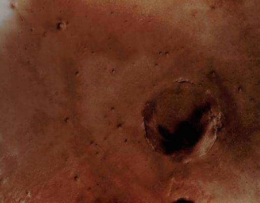 Endeavour Crater (Natural Colors; credits: Lunexit)
The largest crater in this mosaic of images taken by the Context Camera on NASA's Mars Reconnaissance Orbiter is Endeavour Crater, which is approx. 22 Km (about 14 miles) in diameter. 
The team operating NASA's Mars Exploration Rover Opportunity in the Meridiani Planum Region of Mars chose to drive the Rover toward Endeavour after Opportunity ascended out of smaller Victoria Crater in August 2008. 
Opportunity caught its first glimpse of Endeavour's rim on March 7, 2008, during the 1820th Martian Day, or Sol, of the Rover's Mission on Mars. The Rover was about 12 Km (approx. 7 miles) from the closest point of Endeavour.
Parole chiave: Mars from orbit - Craters - Endeavour Crater