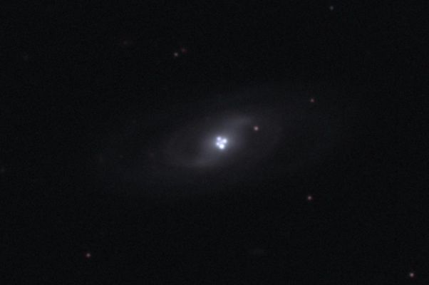The "Einstein Cross"
Dalla Rubrica "NASA - Picture of the Day" del giorno 7 Febbraio 2010:"Most Galaxies have a single Nucleus, we know that. But does this Galaxy have four? 

The strange answer leads astronomers to conclude that the Nucleus of the surrounding galaxy is not even visible in this image. The central cloverleaf is rather light emitted from a background Quasar. The Gravitational Field of the visible foreground galaxy breaks light from this distant Quasar into four distinct images. 

The Quasar must be properly aligned behind the center of a massive galaxy for a mirage like this to be evident. The general effect is known as "Gravitational Lensing", and this specific case is known as the "Einstein Cross". Stranger still, the images of the Einstein Cross vary in relative brightness, enhanced occasionally by the additional gravitational microlensing effect of specific stars in the foreground galaxy".
Parole chiave: From Space Images - Hubble Space Telescope (HST)