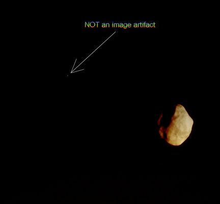 Helene and a "Bright Companion" (possible True Colors; credits: Lunar Explorer Italia)
Caption NASA:"N00124458.jpg was taken on November 24, 2008 and received on Earth November 25, 2008. The camera was pointing toward HELENE that, at the time, was approx. 68.171 Km away.
The image was taken using the CL1 and CL2 filters".

Nota Lunexit: Helene è senza dubbio affascinante, con il suo colore rosso-arancio (tipico di tanti Corpi Celesti Minori e, in questo caso, anche esaltato dalla luce rosa-salmone che deriva dal Gigante Saturno), ma noi Vi invitiamo a considerare il puntino luminoso che viene inquadrato dalla freccia. Ebbene, a nostro avviso NON si tratta di un image-artifact e non dovrebbe essere una stella che splende sullo sfondo (la quale sarebbe dovuta sparire, letteralmente ingoiata - tecn. "washed away" - dalla stessa luminostà di Helene).
Che cosa sarà mai? La nostra ipotesi è: forse (e ribadiamo FORSE!) si potrebbe trattare di un altro - minuscolo - Corpo Roccioso, non troppo distante da Helene. 
Forse una "luna" di Helene stessa (un fenomeno decisamente raro, ma non impossibile: ricordate l'asteroide Ida ed il suo piccolissimo compagno Dactyl? Beh, questo potrebbe essere un fenomeno analogo...).
Parole chiave: Saturn's Moon - Helene