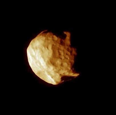 Just like an old "apple": Helene (False Colors)
Caption NASA:"The Cassini spacecraft reveals details on the surface of small, irregularly shaped Helene in this close-up view, obtained during the Spacecraft's closest encounter with this moon during its four-year primary mission. 
Helene (32 Km, or 20 miles across) is a Trojan Moon, sharing Dione's orbit but staying 60° or 400.000 Km (about 250.000 miles) ahead of the much larger moon. 

The image was taken in visible green light with the Cassini spacecraft narrow-angle camera on July 20, 2007. The view was acquired at a distance of approx. 39.000 Km (such as about 24.000 miles) from Helene and at a Sun-Helene-spacecraft, or phase, angle of 61°. 
Image scale is roughly 231 meters (758 feet) per pixel".
Parole chiave: Saturn's Moons - Helene