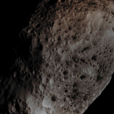 Farewell Hyperion! Part II (Absolute Natural Colors; credits for the additional process. and color.: Dr Paolo C. Fienga/Lunar Explorer Italia/Italian Planetary Foundation)
The NASA - Cassini Spacecraft's Imaging Scientists processed this view of Saturn's so-called "spongy" moon Hyperion, which was taken - just like yesterday's one - during a close Fly-By that occurred on May 31, 2015. This Fly-By marks the Mission's Final Close Approach to this Saturnian highly irregularly shaped moon. North on Hyperion is up and rotated 34° to the left (Sx). 

The image was taken in Visible Light, with the NASA - Cassini Spacecraft's Narrow-Angle Camera - as we wrote herebefore - on May 31, 2015. The view was acquired at a distance of approximately 24.000 miles (such as about 38.624,159 Km) from Hyperion and at a Sun-Hyperion-Cassini Spacecraft, or Phase, Angle of 46°. Image scale is roughly 145 feet (such as approx. 44,196 meters) per pixel. l.

This frame (which is an Original NASA - CASSINI Spacecraft's b/w and NON Map-Projected image published on the NASA - Planetary Photojournal with the ID n. PIA 17194) has been additionally processed, contrast enhanced, magnified to help the visibility of the Surface details, Gamma corrected and then re-colorized - according to an educated guess (or, if you wish, an informed speculation) carried out by Dr Paolo C. Fienga - in Absolute Natural Colors (such as the colors that a human eye would actually perceive if someone were onboard the NASA - Cassini Spacecraft and then looked outside, towards the Saturnian moon "Hyperion"), by using an original technique created - and, in time, dramatically improved - by the Lunar Explorer Italia Team. Different colors, as well as different shades of the same color, mean, among other things, the existence of different Elements (Minerals) present on the Surface of Hyperion, each having a different Albedo (---> Reflectivity) and Chemical Composition.

Note: it is possible (but we, as IPF, have no way to be one-hundred-percent sure of such a circumstance), that the actual luminosity of Hyperion - as it is in this frame - would appear, to an average human eye, a little bit lower than it has been shown (or, better yet: interpreted) here.
Parole chiave: Saturnian Moons - Hyperion