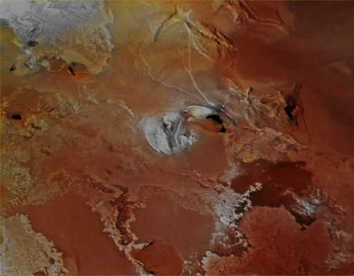 Volcanic Plains and Paterae on Io: Galai Patera (Absolute Natural Colors; credits for the additional process. and color.: Dr Paolo C. Fienga/Lunar Explorer Italia/Italian Planetary Foundation)
Io's Volcanic Plains and at least 9 (nine) Paterae are shown, once again, in this really beautiful and highly suggestive NASA - Voyager 1 Space Probe image, which spans an area of about 1030 Km (such as approx. 640 miles) from left to right. North is at about the 01:30 o'clock position on the frame. A number of active Volcanic Calderae and huge Lava Flows are visible here: the most important (both for size and activity) is the dark red "teardrop-shaped" Surface Feature visible near the center of the frame, slightly to the right, which is Galai Patera, an approx. 100-Km-long (such as about 62 miles) Lava-flooded Caldera (---> Collapsed Vent). As we have already mentioned in yesterday's APOD, the exact composition of Io's Volcanic Plains and Lava Flows has not been determined yet; however, the prevalent yellow, brown, and orange materials may consist, dominantly, of Sulphur, with Surface Frosts made of Sulphur Dioxide and Silicates (such as Basalt), encrusted with Sulphur and Sulphur Dioxide Condensates. The dark red (and, sometime, almost black) spots visible all around the frame, of course including Galai Patera, are hot Sulphur Lava Lakes, which may remain molten for a long time, thanks to the intrusions of molten Silicate Magma that (probably in an almost continuous way) comes up from deep inside Io. Finally, the whitish patches visible at the upper left corner, in the center and on the lower left side of the picture are, most likely, Fresh Deposits of Sulphur Dioxide Frost.
This picture (which is an Original NASA - Voyager 1 Space Proble color image mosaic published on the NASA - Planetary Photojournal with the n. PIA 00324) has been additionally processed and then re-colorized in Absolute Natural Colors (such as the colors that a human eye would actually perceive if someone were onboard the NASA - Voyager 1 Space Probe and then looked outside, towards the limb of the Jovian moon Io), by using an original technique created - and, in time, dramatically improved - by the Lunar Explorer Italia Team. Different colors, as well as different shades of the same color, mean, among others, the existence of different Elements present on the Surface of Io, each having a different Albedo (---> Reflectivity) and Chemical Composition.
Parole chiave: Jovian Moons - Io