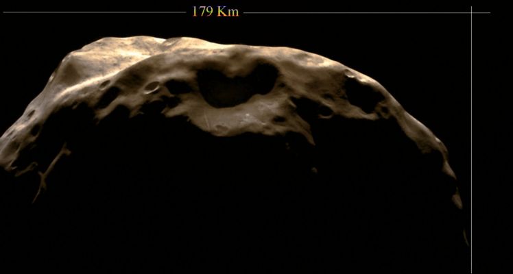 Janus (possible True Colors; credits: Lunexit)
Caption NASA:"This shadowy scene is one of the Cassini Spacecraft's closest views of Saturn's moon Janus. 
The slopes of some craters here display hints of the darker material better seen on Epimetheus. A bright linear feature runs up the wall of the large crater at bottom center. 
This view looks toward Southern Latitudes on Janus (about 179 kilometers, or 111 miles across). North is toward the top of the image and rotated 58° to the right. 

The image was taken in visible light with the Cassini Spacecraft narrow-angle camera on June 30, 2008. The view was obtained at a distance of approx. 33.000 Km (such as about 21.000 miles) from Janus and at a Sun-Janus-Spacecraft, or Phase, Angle of 120°. Image scale is roughly 200 meters (656 feet) per pixel".
Parole chiave: Saturn's Moon - Janus