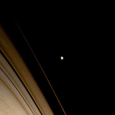 Janus: the RingMaster (natural colors; credits: Lunexit)
Caption NASA:"Saturn's battered moon Janus wears the record of its long history of impacts. 
Janus (approx. 179 Km, or about 111 miles across) orbits just beyond the outer reaches of Saturn's "A" and "F" Rings, which are seen here. 

This view looks toward the unilluminated side of the rings from about 4° above the Ring-Plane. The image was taken in Visible Light with the Cassini Spacecraft narrow-angle camera on Sept. 28, 2008. 
The view was obtained at a distance of approx. 1,1 MKM (such as about 703.000 miles) from Janus and at a Sun-Janus-Spacecraft, or Phase, Angle of 28°. 
Image scale is roughly 7 Km (about 4,5 miles) per pixel".
Parole chiave: Saturn's Moon - Janus