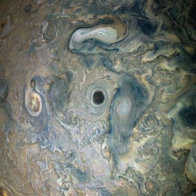 Jupiter Abyss...
Caption NASA Originale:"NASA's Juno spacecraft captured this view of an area within a Jovian jet stream showing a vortex that has an intensely dark center. Nearby, other features display bright, high altitude clouds that have puffed up into the sunlight.

The color-enhanced image was taken at 12:55 a.m. PDT (3:55 a.m. EDT) on May 29, 2019, as the spacecraft performed its 20th science fly-by of Jupiter. At the time, Juno was about 9.200 miles (approx. 14.805,96 Km) from the Planet's cloud tops, above approximately 52° North Latitude.

Citizen scientists Gerald Eichstädt and Seán Doran created and named this image using data from the spacecraft's JunoCam imager".
Parole chiave: Jupiter
