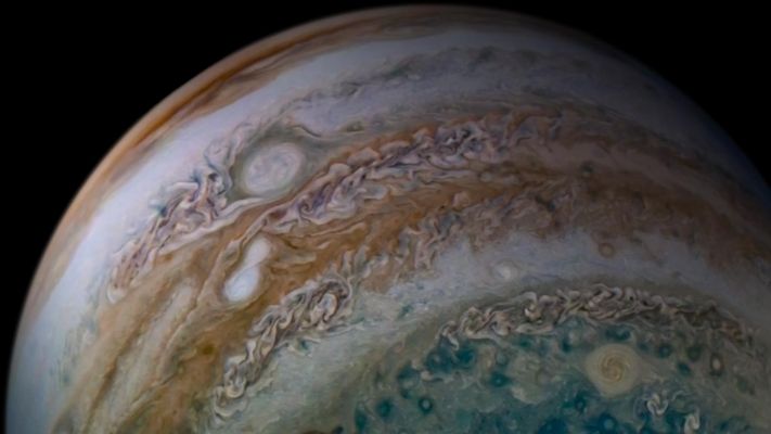 White Storm on Jupiter
Caption NASA Originale:"This view of Jupiter's Upper Atmosphere from NASA's Juno Spacecraft includes something remarkable: two storms caught in the act of merging.

The two white ovals seen within the orange-colored band left of center are Anticyclonic Storms — that is, storms that rotate counter-clockwise. The larger of the two ovals has been tracked for many years, as it grew in size through mergers with other Anticyclonic white ovals. 
JunoCam was fortunate to capture this new merger, which typically takes place over the course of only a few days. 
The event interests scientists because the ovals had approached each other months earlier, only to move apart again.

This merger may be the result of perturbations due to the proximity of Oval BA, which is the larger storm just to the North of the two merging, white ovals. Oval BA is the second largest Anticyclonic Vortex in Jupiter's Atmosphere (second only to the famous Great Red Spot). During this pass over Jupiter, Juno gave scientists their best views of Oval BA to date.

Citizen scientist Tanya Oleksuik created this color-enhanced image using data from the JunoCam camera. The original image was taken on December, 26, 2019, at 10:28 a.m. PST (1:28 p.m. EST) as the Juno Spacecraft performed its 24th close fly-by of the Planet. At the time, the Spacecraft was about 44.900 miles (such as approx. 72.259,54 Km) from the tops of Jupiter's clouds, at a latitude of about 60° South".
Parole chiave: Jupiter
