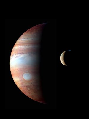 Like Father and Son... (approx. true colors; credits: NASA)
Caption NASA:"This is a montage of New Horizons images of Jupiter and its volcanic moon Io, taken during the Spacecraft's Jupiter flyby in early 2007. The Jupiter image is an infrared color composite taken by the spacecraft's near-infrared imaging spectrometer, the Linear Etalon Imaging Spectral Array (LEISA) at 1:40 UT on Feb. 28, 2007. The infrared wavelengths used (red: 1.59 µm, green: 1.94 µm, blue: 1.85 µm) highlight variations in the altitude of the Jovian cloud tops, with blue denoting high-altitude clouds and hazes, and red indicating deeper clouds. The prominent bluish-white oval is the Great Red Spot. The observation was made at a solar phase angle of 75° but has been projected onto a crescent to remove distortion caused by Jupiter's rotation during the scan. 
The Io image, taken at 00:25 UT on March 1st 2007, is an approx. true-color composite taken by the panchromatic Long-Range Reconnaissance Imager (LORRI), with color information provided by the 0.5 µm ("blue") and 0.9 µm ("methane") channelsof the Multispectral Visible Imaging Camera (MVIC). The image shows a major eruption in progress on Io's night side, at the northern volcano Tvashtar. Incandescent lava glows red beneath a 330-kilometer high volcanic plume, whose uppermost portions are illuminated by sunlight. The plume appears blue due to scattering of light by small particles in the plume ".
Parole chiave: Jupiter and Io
