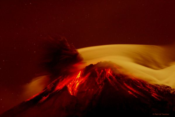 Just like Io!
Caption NASA:"Volcano Tungurahua erupted spectacularly last year. Pictured above, molten rock so hot it glows visibly pours down the sides of the 5000-meter high Tungurahua, while a cloud of dark ash is seen being ejected toward the left. 
Wispy white clouds flow around the lava-lit peak, while a star-lit sky shines in the distance. 
The above image was captured last year (2006) as ash fell around the adventurous photographer. Located in Ecuador, Tungurahua has become active roughly every 90 years since for the last 1300 years. Volcano Tungurahua has started erupting again this year and continues erupting at a lower level even today".

Nota: i colori sono stati alterati dallo STAFF Lunexit, cosÃ¬ da rendere l'immagine piÃ¹ esotica e, a nostro parere, piÃ¹ simile a quello che potrebbe essere un vulcano situato sulla Luna Galileiana "Io". 
Chiediamo scusa al Dr Tashler (l'Autore dell'immagine originale) per la manipolazione.
Parole chiave: Artistic Pictures