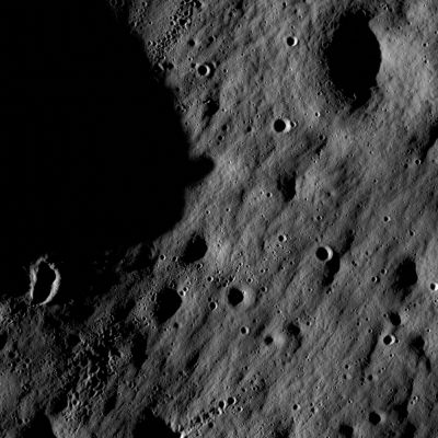 Craters in the Lunar Highlands near Mare Nubium (2)
NASA's Lunar Reconnaissance Orbiter has transmitted its first images since reaching the moon on June 23, 2209. 
The spacecraft's two cameras, collectively known as the Lunar Reconnaissance Orbiter Camera, or LROC, were activated June 30. 
The cameras are working well and have returned images of a Region in the Lunar Highlands, South of Mare Nubium (Sea of Clouds).

As the moon rotates beneath LRO, LROC gradually will build up photographic maps of the Lunar Surface.

"Our first images were taken along the Moon's Terminator -- the dividing line between day and night -- making us initially unsure of how they would turn out", said LROC Principal Investigator Mark Robinson of Arizona State University in Tempe. 
"Because of the deep shadowing, subtle topography is exaggerated, suggesting a craggy and inhospitable surface. In reality, the area is similar to the region where the Apollo 16 Astronauts safely explored in 1972. While these are magnificent in their own right, the main message is that LROC is nearly ready to begin its mission".
Parole chiave: The Moon from orbit - Craters - Unnamed Craters in Mare Nubium