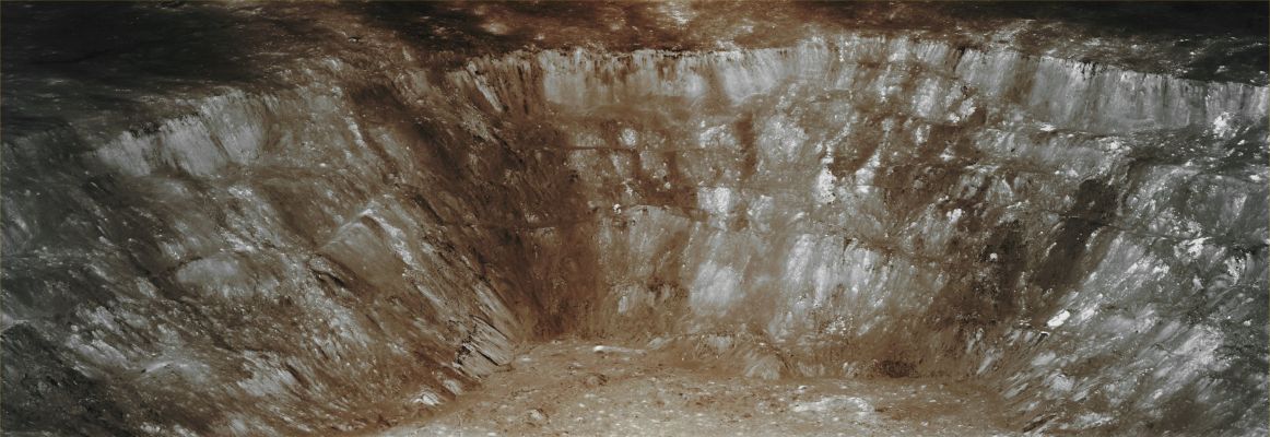 Features of Aristarchus Crater (Absolute Natural Colors; credits for the additional process. and color.: Dr Paolo C. Fienga - Lunexit Team)
Aristarchus is a prominent Lunar Impact Crater that lies in the North/Western portion of the Moon's Near Side. It is considered the brightest of the large formations on the Lunar Surface, with an Albedo that is nearly two times brighter that the one of most of the Lunar Features. In fact, Aristrachus is bright enough to be visible to the naked eye, and it becomes dazzling in a large telescope. It is also relatively easy to identify when most of the Lunar Surface is illuminated by the Earthshine.
This Crater lies at the South/Eastern Edge of the Aristarchus Plateau: an elevated rocky rise located within the Oceanus Procellarum and that contains a number of Volcanic Features and that is also well known for the occurrence of a large number of reported Transient Lunar Phenomena (or TLP), as well as for very recent emissions of Radon Gas (emission which were duly registered and measured by the Lunar Prospector Spacecraft). As additional reference points, we remind you that Aristarchus Crater is located just to the East of the Crater Herodotus and the Vallis Schröteri, and South of a system of narrow Sinuous Rilles named Rimae Aristarchus. Probably, the main reason for Aristarchus' brightness is that it is a (relatively, of course) young formation (such as approximately 450 Million Years old) and so the Solar Wind has not yet had enough time to darken the excavated material via the process known as "Space Weathering". The impact which created Aristarchus likely occurred after the creation of the Rayed Crater Copernicus, but some time before the appearance of the Crater Tycho.

Aristarchus was originally named after the Greek Astronomer Aristarchus of Samos, by the Italian map maker Giovanni Riccioli. His work "Almagestum Novum", published in 1651, gave to the, in that time known "spot-shaped telescopic features" (such as the Impact Craters) the eponyms of famous Astronomers and Philosophers. Although the name of Aristarchus Crater has always been widely accepted and adopted, it actually did not become "official" (from an International point of view), until the International Astronomical Union (IAU) so decided to name it, during a General Assembly that was taken in the AD 1935.

As we already wrote hereabove, the Region of the Aristarchus Plateau (and the Crater Aristarchus in particular) has been (and still is) the site of many reported Transient Lunar Phenomena, with a total of 122 reports by the AD 2007: the highest recorded for any Lunar Feature. 
Such a TLPs include, among others, Temporary Obscurations and Colorations of the Surface; the appearence of Star-like Shinings (either fixed or slightly moving) as well as isolated Flashes of Red, Blue or even Green light. Official Catalogues mentioning these TLPs show that more than one-third of the most reliable observations came from Aristarchus Crater and its immediate surroundings. 

In 1971, when the NASA Apollo 15 Spacecraft passed at about 110 Km from the Surface of the Aristarchus Plateau, a significant rise in Alpha Particles was detected and these particles are thought to be caused by the presence of huge amounts, in the area, of Radon-222: a radioactive and colorless Noble Gas that forms naturally during and as part of the normal Decay Chain of Uranium or Thorium; the Radon -222 possesses a so-called "half-life" of only 3,8 days. 
The Lunar Prospector Mission later confirmed Radon-222 emissions from Aristarchus. Some of these fascinating (and still not totally understood) observations could be explained by the occurrence of discrete Explosive Events (Outgassings).
Parole chiave: The Moon from Orbit - Craters - Aristarchus Crater