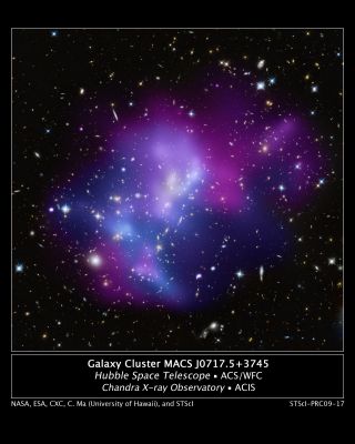 MACS J0717.5+3745 (Galaxy Cluster)
This composite image shows the massive Galaxy Cluster MACS J0717.5+3745 (MACS J0717, for short), where four separate Galaxy Clusters have been involved in a collision — the first time such a phenomenon has been documented. Hot gas is shown in an image from NASA's Chandra X-ray Observatory, and galaxies are shown in an optical image from NASA's Hubble Space Telescope. 
The hot gas is color-coded to show temperature, where the coolest gas is reddish purple, the hottest gas is blue, and the temperatures in between are purple.

The repeated collisions in MACS J0717 are caused by a 13 MLY-long stream of galaxies, gas, and dark matter — known as a "Filament" — pouring into a region already full of matter. A collision between the gas in two or more clusters causes the hot gas to flow down. However, the massive and compact galaxies do not slow down as much as the gas does, and so move ahead of it. Therefore, the speed and direction of each cluster's motion — perpendicular to the line of sight — can be estimated by studying the offset between the average position of the galaxies and the peak in the hot gas.

MACS J0717 is located about 5,4 BLY from Earth. It is one of the most complex Galaxy Clusters ever seen. Other well-known Clusters, like the Bullet Cluster and MACS J0025.4-1222, involve the collision of only two galaxy clusters and show much simpler geometry.
Parole chiave: From Space Images - Hubble and Chandra X-Ray