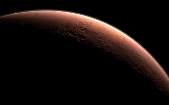 Daybreak at Gale Crater 
Caption NASA:"This computer-generated view depicts part of Mars at the boundary between darkness and daylight, with an area including Gale Crater beginning to catch morning light.
Northward is to the left. Gale is the crater with a mound inside it near the center of the image. 

NASA has selected Gale as the landing site for the Mars Science Laboratory mission. The mission's rover will be placed on the ground in a northern portion of Gale crater in August 2012. 

Gale crater is approx. 96 miles (about 154 Km) in diameter and holds a layered mountain rising about 3 miles (approx. 5 Km) above the Crater Floor; the intended Landing Site is at about 4,5° South Latitude and 137,4° East Longitude.

This view was created using three-dimensional information from the Mars Orbiter Laser Altimeter, which flew on NASA's Mars Global Surveyor orbiter. The vertical dimension is not exaggerated. Color information is based on general Mars color characteristics".
Parole chiave: Fantasy