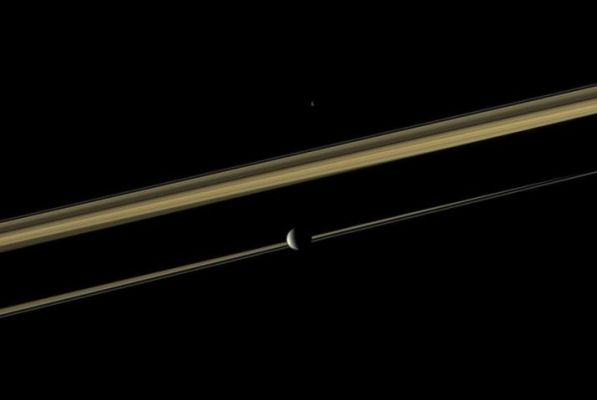 In-Between (Natural Colors; credits: NASA/JPL/Space Science Institute)
Caption NASA:"Two of Saturn's moons straddle the Planet's Rings in this view. Mimas is closest to the Cassini Spacecraft here. Epimetheus, instead, is on the far side of the Rings. 
Saturn's shadow cuts across the middle of the Rings. This view looks toward the sunlit side of the Rings from just above the Ring-Plane.

Images taken using red, green and blue spectral filters were combined to create this Natural Color view. The images were obtained with the Cassini Spacecraft narrow-angle camera on Oct. 24, 2009 at a distance of approx. 2,7 MKM (such as about 1,7 MMs) from Epimetheus and approx. 2,4 MKM (about 1,5 MMs) from Mimas. 
Scale on Mimas is roughly 14 Km (a little less than 9 miles) per pixel".
Parole chiave: Saturn's Moon - Mimas and Epimetheus