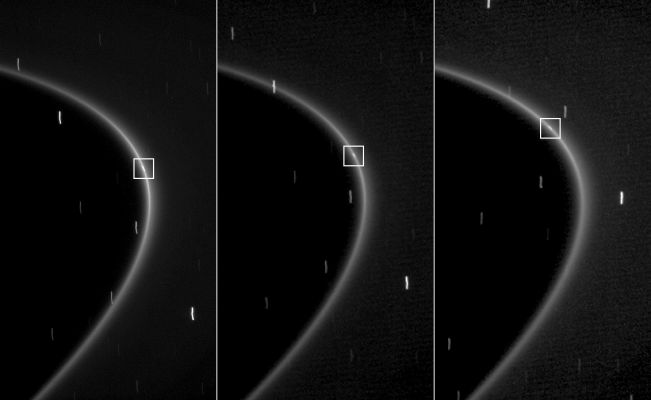 Tiny Moonlet within a G-Ring Arc
Caption NASA:"This sequence of three images, obtained by NASA's Cassini Spacecraft over the course of about 10 minutes, shows the path of a newly found moonlet in a bright arc of Saturn's faint G-Ring. 
In each image, a small streak of light within the Ring is visible. Unlike the streaks in the background, which are distant stars smeared by the camera's long exposure time of 46", this streak is aligned with the G-Ring and moves along the ring as expected for an object embedded in the Ring. 
Cassini scientists interpret the moving streak to be reflected light from a tiny moon half a kilometer (a third of mile) wide that is likely a major source of material in the arc and the rest of the G-Ring. 
Debris knocked off this moon forms a relatively bright arc of material near the inner edge of the G-Ring, the most visible part of the Ring in these images. That arc, in turn, leaks material to form the entire Ring. 

These images were captured by Cassini's narrow-angle camera on Oct. 27, 2008. 
The first image (left) was taken in Visible Light, the second image (middle) was taken in Red Light, and the third image (right) in Near-InfraRed Light centered at a wavelength of 750 nanometers. 
Image scale for the first image is roughly 7 Km (a little more than 4 miles) per pixel while the second and third were taken at reduced resolution. 
These spatially compressed images were captured at 14 Km (about 9 miles) per pixel and then displayed at a size equal to the first image. This view looks toward the un-illuminated side of the Rings from about 5° above the Ring-Plane. 
The view was acquired at a distance of approx. 1,2 MKM (such as about 751.000 miles) from Saturn and at a sun-Saturn-Spacecraft, or Phase, Angle of 23°".
Parole chiave: Saturn's Moonlet