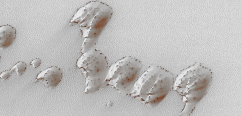 The Frozen Dunes of the North in early Spring (Natural Colors; credits for the additional process. and color.: Dr Paolo C. Fienga - Lunexit Team)
Caption NASA originale:"This MGS-MOC image shows a group of sand dunes, covered by seasonal Carbon Dioxide frost, in the Martian North Polar Region. Over the course of Northern Hemisphere Spring, the CO2 frost sublimes away, slowly revealing the dark sand that makes up the dunes. The dark spots in this image may be patches of freshly-exposed sand, or they could be places where the CO2 frost has changed, either becoming rougher, coarser-grained (larger crystals), or both. A rougher or coarser-grained surface will appear darker because of an increase in shadowing of the surface by the small-scale roughness elements".

Location near: 75,2° North Lat.and 51,3° West Long.
Image width: ~3 Km (~1,9 mi) 
Illumination from: lower left 
Season: Northern Spring
Parole chiave: Mars from orbit - North Polar features