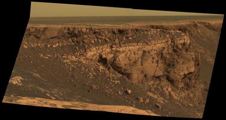 Cape St Vincent (approx. true colors - elab. NASA)
Caption NASA:"This image captured by NASA's MER Opportunity shows "Cape St. Vincent" one of the many promontories that jut out from the walls of Victoria Crater, Mars. The material at the top of the promontory consists of loose, jumbled rock, then a bit further down into the crater, abruptly transitions to solid bedrock. 
This transition point is marked by a bright band of rock, visible around the entire crater. 
Scientists say this bright band represents what used to be the surface of Mars before it was impacted to form Victoria Crater. As Opportunity begins to descend into the crater in early July 2007, it will examine the band carefully at an accessible location with a gentle slope. 
These investigations might help determine if the band's brighter appearance is the result of ancient interactions with the Martian atmosphere. 
This image was taken by Opportunity's PanCam on Sol 1167 (May 6, 2007). 
It is presented in approximately true color".
Parole chiave: Victoria Crater