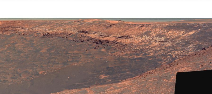 Duck Bay - Sol 1196
Caption NASA:"This image shows "Duck Bay", an alcove in the rim of Victoria Crater. NASA's MER Opportunity will roll down the slopes of Duck Bay in early July 2007 and investigate the rocks inside the Crater. One of its first targets will be the bright band of bedrock seen here lining the upper portion of the crater walls. 
This band appears to be unlike anything encountered before at Opportunity's Landing Site. 
Scientists say it marks the spot where the ground surface used to lie just before an impace formed Victoria Crater. 
Future investigations with Opportunity might help determine whether the band's brighter appearance is the result of ancient interactions with the Martian atmosphere".
Parole chiave: Victoria Crater