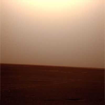 Dark Skies over Opportunity (1) - Sol 1225
A giant dust storm brewing for more than a week on Mars has become worse and is affecting surface operations of the MER Spirit and Opportunity. Because the Rovers depend on solar energy for survival, and the dust is partially blocking the Sun, the storm is being watched closely by the rover scientists and engineers. 
Opportunity's entry into Victoria Crater is delayed for at least several days. 
The storm, the most severe storm yet to hit the Rovers, is expected to continue for at least another week. Opportunity is perched near Duck Bay as it readies to descend into Victoria Crater, but operations were scaled back on Saturday, June 30, to conserve power. 

"The storm is affecting both Rovers and reducing the power levels on Opportunity" said John Callas, MER Project Manager at NASA's JPL, Pasadena, Calif. "We are keeping an eye on this as we go forward, but our entry into Victoria Crater will be delayed until no sooner than July 13".

"We have some data that show the atmospheric opacity is decreasing, so the storm might have peaked and we may have passed the worst of this. The situation could improve quickly from here, but we will have to wait and see", said Callas. 

Weather reports from NASA's Mars Reconnaissance Orbiter Mars Color Imager camera are helping track the storm and plan Rover operations. 
Parole chiave: Martian Horizon - Meridiani Planum