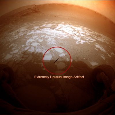 Image-Artifact? (context frame - possible natural colors - elab. Lunexit) - Sol 1298
Dall'occhio - ancora una volta - attentissimo del Dr Gianluigi Barca, un frame apparentemente poco significativo si trasforma in mini-enigma. Il motivo è nella striscia scura che vedete cerchiata in Rosso, quasi al centro del frame. 
Ma si tratta, direte subito, di un image-artifact!

Si, certo, forse è così.

Ma un image-artifact riconducibile a quale tipo di "vizio"? Pensateci sopra e, se lo ritenete opportuno, studiateVi bene l'extra-detail mgnf che segue.

Ed un "Bravo!" - detto sempre di cuore - al Dr Barca, per l'attenzione, la perizia e l'acutezza da sempre messa nello scegliere i frames "intriganti" da proporre ai nostri Lettori.
Parole chiave: Controversial Frame