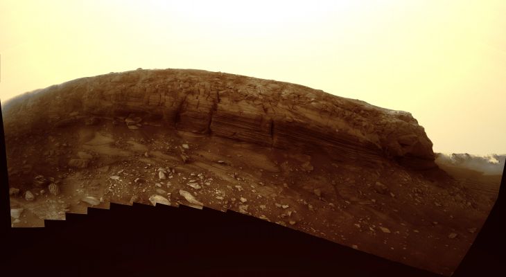 Dusk Lighting of Layered Textures in 'Cape Verde' - Sol 1580 (natural colors; credits: Lunexit)
Full-shade lighting in the late Martian afternoon helps make details visible in this view of the layered cliff face of the "Cape Verde" promontory making up part of the rim of Victoria Crater in the Meridiani Planum Region of Equatorial Mars. 
NASA's Mars Exploration Rover Opportunity used its Panoramic Camera (Pancam) to shoot the dozens of individual images that have been combined into this mosaic. Opportunity was inside Victoria Crater and near the base of the cliff when it took these images on the 1579th and 1580th Martian Days, or Soles, of the mission (such as July 2nd and 3rd, 2008). 

Photographing the promontory from this position in Victoria Crater presented challenges for the rover team. The geometry was such that Cape Verde was between the Rover and the Sun, which could cause a range of negative effects, from glinting off PanCam's dusty lenses to shadowing on the cliff face. The team's solution was to take the images for this mosaic just after the Sun disappeared behind the Crater Rim, at about 17:30 M.L.T.. 
The atmosphere was still lit, but no direct Sunlight was illuminating the wall of Cape Verde. The result is a high-resolution view of Cape Verde in relatively uniform diffuse sky lighting across the scene. 

PanCam used a clear filter for taking the images for this mosaic. Capturing images in low-light situations was one of the main motivations for including the clear filter among the camera's assortment of filters available for use. 
The face of Cape Verde is about 6 meters (20 feet) tall. Victoria Crater, at about 800 meters (one-half mile) wide, is the largest and deepest crater that Opportunity has visited. It sits more than 5 Km (almost 4 miles) away from Opportunity's Eagle Crater Landing Site. Researchers sent Opportunity into Victoria Crater to study the rock layers exposed inside. The textures seen in the rock layers of Cape Verde suggest that the exposed layers were originally deposited by wind.
Parole chiave: Victoria Crater - Inner Rim - Cape Verde