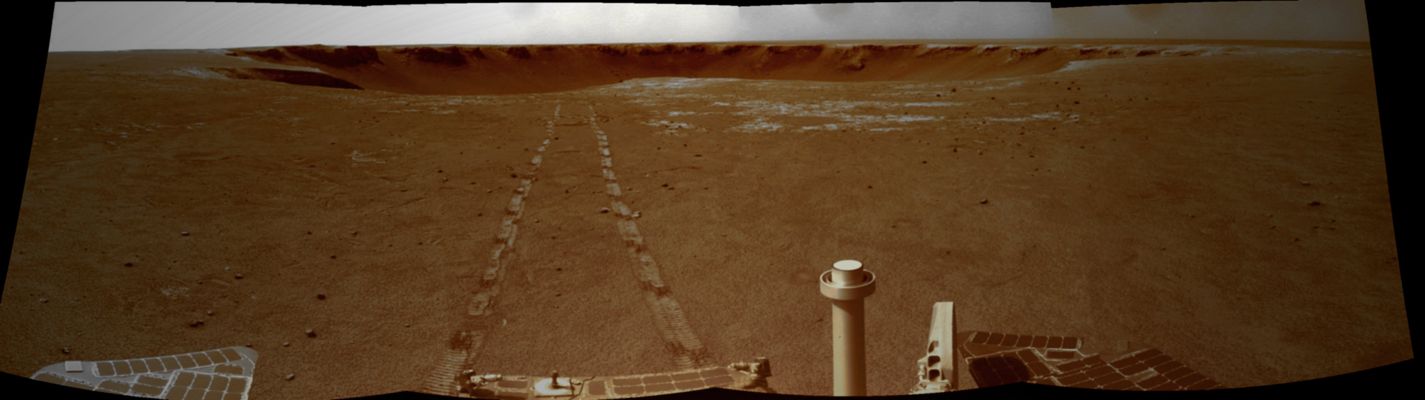 Farewell Victoria! - Sol 1683 (tri-chromatic version; credits: Lunar Explorer Italia)
Caption NASA:"Since leaving "Victoria Crater", Opportunity has picked up the pace of driving. In the 90 Soles since exiting the Crater, Opportunity has driven more than 1800 meters (1,1 miles), such as three times the distance that was required for the original prime mission. 
Scientists expect to encounter younger rocks the farther South the Rover travels. They also expect to find small rocks ejected onto the landscape during formation of nearby craters and to reach these things, the Rover must avoid sand traps as much as possible. 

Opportunity acquired this mosaic with the Navigation Camera on the Rover’s 1683rd Sol (Oct. 18, 2008), of exploration".
Parole chiave: Postcard from Mars - Victoria Crater