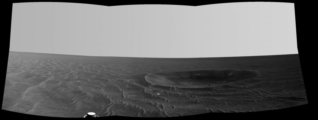 Yankee Clipper - Sol 2410 (an Original NASA b/w Image-Mosaic - credits: NASA/JPL-Caltech)
Caption NASA:"Yankee Clipper Crater on Mars carries the name of the CSM (Command and Service Module) of NASA's 1969 Apollo 12 Mission to the Moon. 
NASA's Mars Exploration Rover Opportunity recorded this view of the Crater during a pause in a 102-meter (365-foot) drive during the 2410th Sol of the Rover's work on Mars (such as Nov., 4th, 2010).
This view is a mosaic of three frames taken by the left eye of Opportunity's NavCam. Yankee Clipper Crater is about 10 meters (33 feet) in diameter. 
The Rover Science Team uses a convention of assigning the names of historic ships of exploration as the informal names for Craters seen by Opportunity. Apollo 12's Yankee Clipper orbited Earth's Moon while the Mission's LM (Lunar Module) carried two Astronauts to the Lunar Surface on November, 19th, 1969, and later brought all three of the Mission's Astronauts back to Earth, arriving on November, 24th, 1969".
Parole chiave: Martian Surface - Craters - Yankee Clipper Crater
