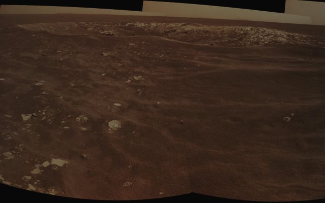 Freedom 7 - Sol 2585 (Absolute Natural Colors; credits for the additional process. and color.: Dr Paolo C. Fienga - Lunexit Team)
Caption NASA:"NASA's Mars Exploration Rover Opportunity recorded this view of a Crater informally named "Freedom 7" shortly before the 50th anniversary of the first American in space: astronaut Alan Shepard's flight in the Freedom 7 Spacecraft. 

The image combines two frames that Opportunity took with its NavCam during the 2585th Martian Day, or Sol, of the Rover's work on Mars (May 2, 2011). Shepard's suborbital flight lasted 15 minutes on May 5, 1961. 

The Crater is about 25 meters (82 feet) in diameter. It is the largest of a Cluster of about 8 craters all formed just after an Impactor broke apart in the Martian Atmosphere. By taking advantage of seeing many Craters of diverse ages during drives between major destinations, the Opportunity mission is documenting how Impact Craters change with time. The Cluster that includes Freedom 7 crater formed after sand ripples in the area last migrated, which is estimated to be about 200.000 years ago".
Parole chiave: Martian Surface - Craters - Freedom 7