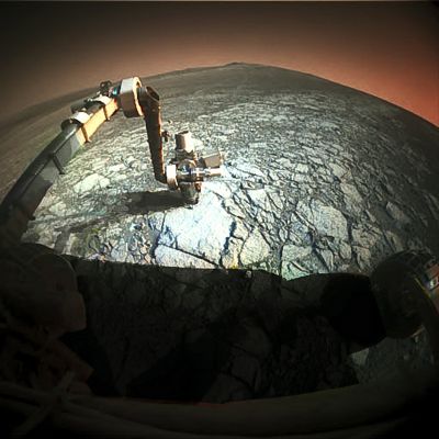 Bright Sun, Dark Sky - Sol 2998 (Natural Colors; credits for the additional process. and color.: Elisabetta Bonora and Marco Faccin - Lunar Explorer Italia/Italian Planetary Foundation)
We said that in the past and we have to say it again: how many times have we already read (here, there and everywhere...), that the Martian Sky should be "Blue" (actually, "Light Blue", according to the "Raleigh Scattering" Model)? Certainly a thousand times (at least!) and, well, maybe some time ago, the question could have made some sense. 
But now, after so many Natural and Absolute Colorizations of the NASA - MER Spirit and Opportunity's Original b/w Frames, how could we keep doubting? Color, brightness, nuances of the Martian Sky... Let's see if we can make a little step forward, once in a while...
Among many other things (and forgetting the color of the Martian Sky for a moment), the NASA People often told us that the Sky of Mars is "bright" and we wish to say that, perhaps, at certain Latitudes and during certain times of the Martian Year (as well as at certain - and given - daytime hours), such a statement could even be reasonable. 

Said that, we honestly believe that, first of all, the Martian Sky is not particularly bright at all. In fact, we believe that the Martian Sky should really (if not extremely) be dark. 
Second, we believe that the Sun, even though its diameter is over one-third smaller than the one which we can see from Earth, shines VERY brightly over the Martian Landscapes: especially, we think, starting from the late morning hours (let's say 09:00/09:30 Mars Local Solar Time) and until, probably (and during the Martian Summer), 16:00 or 17:00 (always Mars Local Solar Time). 
Furthermore, and according to what we have speculated in the past, the portion of the Sky visible near the Martian Horizon, should slightly be brighter than the rest of the Sky. In other words: if you were on Mars, near the Rover and looking at the Horizon of Meridiani Planum, you should see a relatively bright (lower portion of the) Sky that, the more you rise your look, the darker it will get. 

Talking about the color of the Martian Sky, instead, since (and of course...) we haven't been on Mars (yet!) we cannot be one-hundred-percent certain of anything but, after so many years of studying and processing images from the Red Planet, it seems to us quite reasonable and believable to say that the Martian Sky is NOT blue, nor light-blue at all. 
The Martian Sky, most likely, can show itself in quite a few different colors, but its "natural" one, should be a light-orange. Near the Sun, probably, the NASA People are correct when they say that it should be kind of pale-blue and white; but most of it - in any case and for most part of the day - is and should (almost) always be of a light white/orange color (we repeat: near the horizon), and then (as we look over and above the horizon itself), of an orange/yellowish color that the more we look towards the Zenith (or the Nadir), the darker it should get. 
It is also possible that the Martian Sky might show - at certain conditions - some yellow and pink nuances: this depending on the specific time of the day that we consider, as well as on the Atmospheric Opacity - or TAU - existing at that time, on the Martian Season and on the given Martian Latitude. 

In this beautiful frame, processed in Natural Colors, we can see that the Sky near the Horizon is actually (yet quite dimly) bright, while the rest of the visible Sky is dark. Almost black (we should say that its color looks like a VERY dark orange, which tends to the brown). But the Sun, that is shining (relatively) high in the Sky, is VERY bright! So bright that the Martian Paving where NASA - MER Opportunity is rolling on, appears, to the Electronic Eyes of the Rover, of a bright and sharp white color, with some light-blueish nuances (these nuances being probably caused by the blue cristals that seem to be dispersed all over the place). 

In the end, and just to draw some conclusions, the Martian Sky, in our opinion - as IPF (and no matter what we often see - or think to see... - in the frames that come to us from the Red Planet) -, is usually dark (VERY dark during the Late Fall and through the entire Martian Winter), but the Sun (except during the massive Sand Storms that, sometimes, darken the whole Planet) always shines very bright, particularly during the months corresponding to the Late Spring and Summer of the Red Planet. But a bright Sun, in our opinion, does not mean AT ALL a bright Daytime Sky! And please, forgive us, if, one day, we might be proven wrong...

This frame has been colorized in Natural Colors (such as the colors that a perfect human eye would actually perceive if someone were near the NASA - MER Opportunity and then looked towards the Martian Horizon), by using an original technique created - and, in time, dramatically improved - by the Lunar Explorer Italia Team.
Parole chiave: Martian Horizon - Meridiani Planum - Proximities of Endeavour Crater's Rim