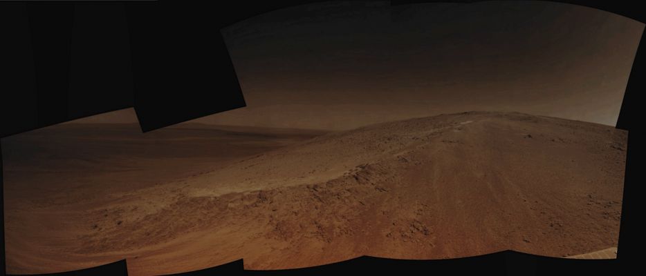 On the Outer Rim of Endeavour Crater (Image-Mosaic - Absolute Natural Colors; credits for the additional process. and color. Dr Paolo C. Fienga/Lunar Explorer Italia/Italian Planetary Foundation)
This is an image-mosaic that shows us the lower reaches of an area of Meridiani Planum (please, remember that we are now very close to the Outer Rim of the large Endeavour Crater) that is informally known as "Murray Ridge". The individual images that were used to create this mosaic were all acquired during the 3466th Sol (such as October, 24, 2013 on Earth) of exploration of the Martian peri-Equatorial Region of Meridiani Planum, by using the Navigation Camera (or "NavCam", for short) that is onboard the NASA - Mars Exploration Rover (MER) - "Opportunity".
This Ridge, as we mentioned herebefore, is part of the Outer Rim of Endeavour Crater and it has been identified by the Opportunity's Science Team as an important Site for scientific exploration. The Ridge has been (so far) informally named "Murray Ridge" to honor the late Dr Bruce Murray, who made fundamental advances in Mars Science and who led the NASA's Jet Propulsion Laboratory through a period of great challenges and achievements. 

This frame (which is an Original NASA - Mars Exploration Rover (MER) - "Opportunity" Original b/w image published on the NASA - Planetary Photojournal and identified by the ID n. PIA 17585) has been additionally processed (where the additional processing has been based on the assumption that the Atmospheric Opacity - "TAU" - of the pictured area was LOW), Gamma corrected and then colorized in Absolute Natural Colors (such as the colors that a normal - meaning "in the average" - human eye would actually perceive if someone were on the Surface of Mars, near the NASA - Mars Exploration Rover (MER) - Opportunity, and then looked ahead, towards the Surface, Horizon and Sky over Endeavour Crater), by using an original technique created - and, in time, dramatically improved - by the Lunar Explorer Italia Team. 

Note: please consider that the Martian Sky (as it has been colored and represented in this picture) appears extremely dark because quite a few of the frames used to make the mosaic were taken during the hours of the Martian Middle/Late Afternoon, such as during that period of the day when the luminosity of the Martian Sky itself (better yetç: that porton of it which is not near, around and/or right above the Sun's disk) drops rapidly and dramatically.
Parole chiave: Martian Surface - Craters - Endeavour Crater - Outer Rim