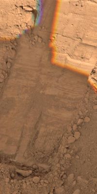 Rasping in 'Snow White' (credits: NASA/JPL/Univ. of Arizona)
Caption NASA:"This image, taken by NASA's Phoenix Mars Lander's Surface Stereo Imager on Sol 50, or the 50th Day of the mission, July 15, 2008, shows two holes at the top created by the lander's Robotic Arm's Motorized Rasp Tool. 
The holes are about 1 centimeter (such as 0,4" - inches) apart".
Parole chiave: Martian Surface - Vastitas Borealis - Surroundings of the Lander