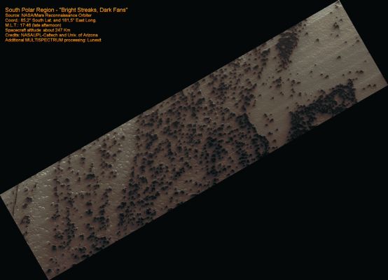Bright Streaks and Dark Fans (MULTISPECTRUM; credits: Lunexit)
In a Region of the South Pole known informally as "Ithaca", numerous Fans of dark frost form every Spring. HiRISE collected a time lapse series of these images, starting at Ls = 185 and culminating at Ls = 294. "Ls" is the way we measure time on Mars: at Ls = 180 the Sun passes the Equator on its way South; at Ls = 270 it reaches its maximum subsolar latitude and Summer begins. 

We believe that the bright streaks are fine frost condensed from the gas exiting the vent. The conditions must be just right for the bright frost to condense. 
Parole chiave: Mars from orbit - South Polar Region - Fans Field
