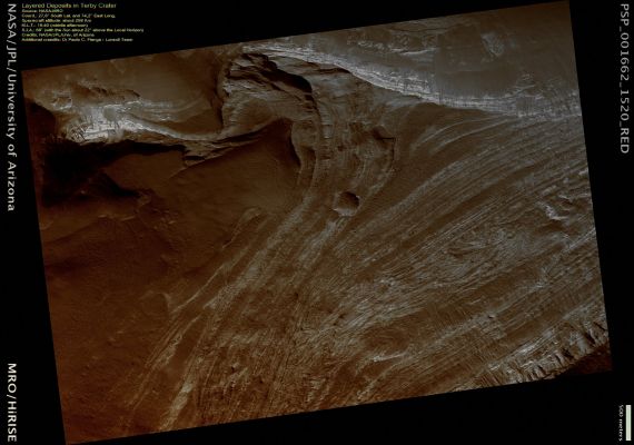 Layered Deposits in Terby Crater (Natural - but enhanced - Colors; credits: Dr Paolo C. Fienga - Lunexit Team)
Terby Crater is a large (approximately 165 Km), Noachian-aged crater located on the Northern Rim of the Hellas Impact Basin.

Terby hosts a very impressive sequence of predominantly light-toned Layered Deposits, up to 2,5 Km thick that are banked along its Northern Rim and extend toward the center of the Crater.
The full image shows this stack of layered rocks as they are exposed Westward facing scarp. The layered sequence consists of many beds that are repetitive, relatively horizontal and laterally continuous on a kilometer scale. Many beds are strongly jointed and fractured and exhibit evidence of small-scale wind scour.
The light-toned layers are typically at least partially covered with dark mantling material that obscures the layers as well as debris and numerous, meter-scale boulders that have cascaded down slope. The processes responsible for formation of these layers remain a mystery, but could include deposition in water, by the wind, or even volcanic activity.

This HiRISE image is a proposed landing site for the Mars Science Laboratory (MSL) in Terby Crater.
Parole chiave: Mars from orbit - Craters - Terby Crater