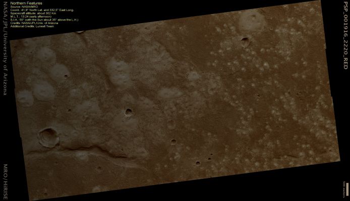 Knobs and Mounds on the Northern Plains (Natural Colors; credits: Dr Paolo C. Fienga - Lunexit Team)
Light-toned Mounds occur across the image. 
The northern part of the image is dominated by small Knobs or Patches, while there are features hundreds of meters across to the South. The larger features frequently have one or more craters and an irregular shape; it has been proposed that these features are Mud Volcanoes, which erupt mud instead of lava. 
On Earth, Mud Volcanoes usually form in conditions of tectonic pressurization or rapid burial of sediments. 

At high resolution, the Knobs show some fine lineations which may be wind-blown material, but are otherwise very smooth. In between the Mounds, the Surface is rough and rich in Boulders. The few Boulders on the Mounds were likely ejected from nearby Impact Craters. 
Information like this from HiRISE images provides useful constraints on the formation and material of these Knobs and Cones.
Parole chiave: Mars from orbit - Northern Plains