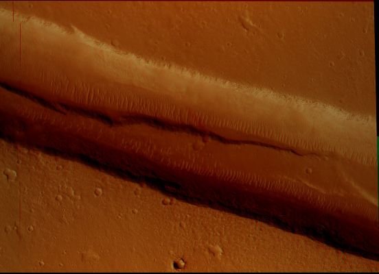 Channel and Graben in Memnonia Fossae (Hi-Def-3D - Extremely Enhanced Natural Colors; credits: Dr M. Faccin & Lunar Explorer Italia)
Latitude (centered): 21,5° South
Longitude (East): 211,2 ° 
Range to target site: 261,1 Km (approx. 163,2 miles) 
Original image scale range: 26,1 cm/pixel (with 1 x 1 binning) so objects ~78 cm across are resolved 
Map projected scale: 25 cm/pixel and North is up 
Map projection: EQUIRECTANGULAR
M.L.T.: 15:37 (middle afternoon)
Emission angle: 9,3° 
Phase angle: 70,6° 
Solar Incidence Angle: 63°, with the Sun about 27 ° above the Local Horizon 
Solar Longitude: 153,1° (Northern Summer)
Parole chiave: Mars from orbit - Graben and Channel - Memnonia Fosae Region