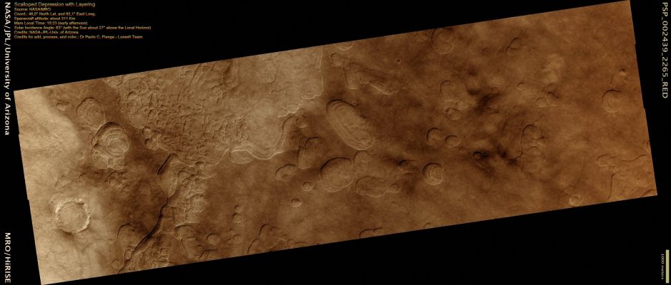 Scalloped Depressions with Layering (False Colors; credits: Dr Paolo C. Fienga - Lunexit Team)
This image of the Northern Plains of Mars is marked by depressions in a layer of material that covers the Region. The depressions, several of which have coalesced together, have scalloped edges and layers in their walls.
Features such as these are most commonly found at approx. 55° North and South latitude. 
Their presence has led to hypotheses of the removal of subsurface material, possibly ground ice, by sublimation, and this process is believed to be ongoing today.
In this image, steeper scarps with layers consistently face the North Pole while more gentle slopes without layers face in the direction of the Equator. This is most likely due to differences in Solar Heating. 
Large boulders, some several meters in length, are scattered within the depressions and on the surrounding Surface. Also on the Surface surrounding the scalloped depressions is a polygonal pattern of fractures. 
This is commonly associated with Scalloped Terrain and indicates that the surface has undergone stress potentially caused by Subsidence (Collapse), Desiccation (Drying-out), or Thermal Contraction.

Parole chiave: Mars from orbit - Vastitas Borealis