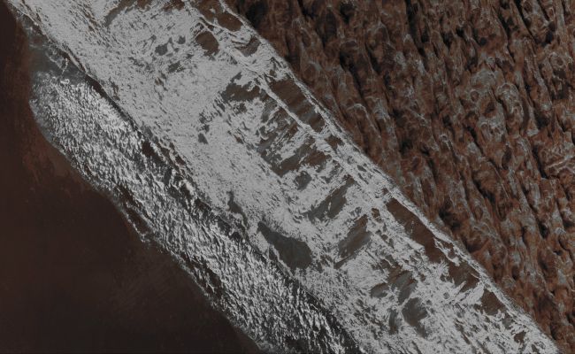 Features of Aram Chaos (EDM n.1 - Absolute Natural Colors; credits for the additional process. and color: Dr Paolo C. Fienga - Lunexit Team)
Caption NASA:"This image captures an enigmatic approximately 6 Km-wide area in central Aram Chaos, a Region that is about 1000 Km in diameter and it is located East of Valles Marineris and just North of the Equator. The image depicts the edge of a light-toned cap unit forming two large sheets in the middle of this Chaotic Terrain. This cap unit is heavily eroded forming the 'icing' texture and terminates with a sharp approximately 300 mt Cliff going diagonally across the area". 
Parole chiave: Mars from orbit - Chaotic Terrain - Aram Chaos