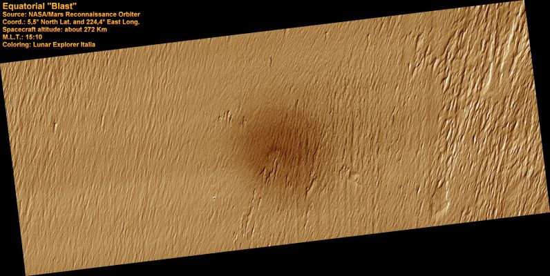 Blast from the (Very Recent) Past
In the center of this image is a very sharp-rimmed impact crater just 35 mt wide. 
It lies in a bright, dust-covered region, but is surrounded by a slightly darker spot about 3 Km wide. The impact event created a blast of high winds that disturbed the dust and darkened the spot.
Since dust is constantly settling over the Region, the fact that we can still see the dark region means the impact event occurred of late, perhaps in recent decades. There are many dark streaks on topographic slopes over an even wider region surrounding the dark spot - these could be due to dust avalanches triggered by the impact, either from the air blast or from seismic shaking of the ground.
There are also rays of very small (approx. 1 mt in diameter) secondary craters extending radially outward from the 35-mt crater, created by the impact of rocks ejected from the main crater. 
Thus a small impact crater has modified the surface over an area more then 10.000 times greater than that of the crater's interior.
Parole chiave: Mars from orbit - Craters - Recent Impact Crater